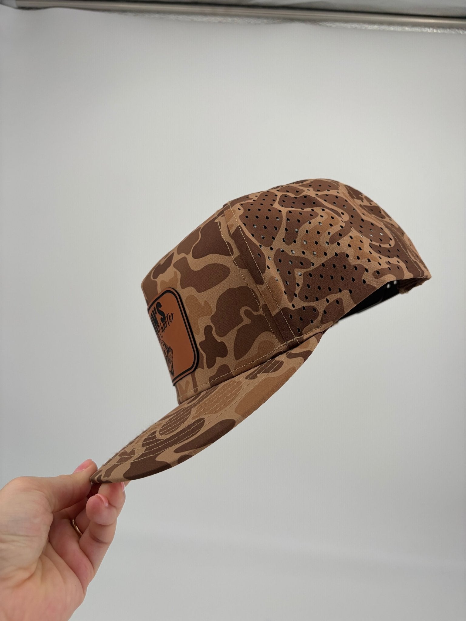 Original Finns Light Wood Camo Leather Logo Blackhawk Trucker Hat - Finn's Fishing Charter