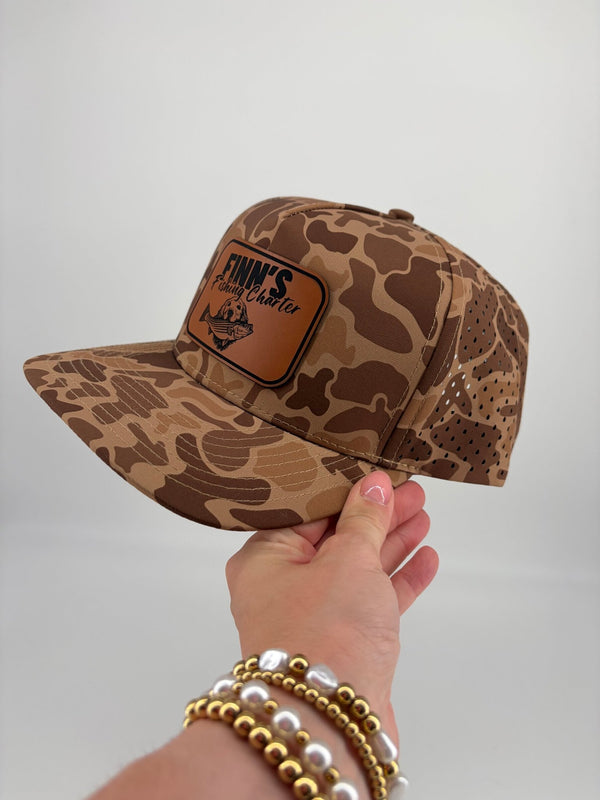 Original Finns Light Wood Camo Leather Logo Blackhawk Trucker Hat - Finn's Fishing Charter